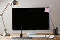 Big computer screen with stationary items Royalty Free Stock Photo