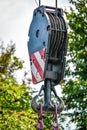 Big construction harbor crane hook pulley and steel ropes wires. Royalty Free Stock Photo