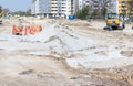 Big construction and reconstruction site with heavy excavator machinery earth mover bulldozer and digger repair asphalt road of th Royalty Free Stock Photo