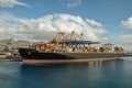 A big container ship is loading cargo in the port Royalty Free Stock Photo