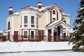 Big cottage with red roof and white drain at Royalty Free Stock Photo