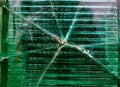 Big crack in the middle of the green glass wall texture, background