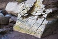Big crack in old stone on sea shore Royalty Free Stock Photo