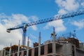 Crane And Building Working Progress, Construction Site in blue sky background Royalty Free Stock Photo