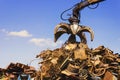 Big crane dropped scrap on pile Royalty Free Stock Photo