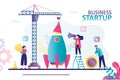 Big crane lowers rocket part. Business people start up new project. Team builds large spaceship Royalty Free Stock Photo