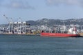 Big cranes and cargo ship at Aotea quay embankment, Wellington, New Zealand
