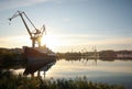 Big cranes and vessel at shipyard on sunny day Royalty Free Stock Photo