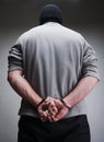 Big criminal locked in handcuffs Royalty Free Stock Photo
