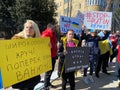 Big Crowd Holding Signs at the Rally