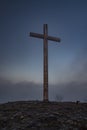 Big crucifix on Radobyl hill over Labe river in norht Bohemia in winter morning