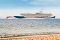 Cruise ship liner and small ferry boat meet together in open sea - vacation and transport concept Royalty Free Stock Photo