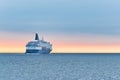 Big cruise ship in the sea at sunset. Beautiful seascape Royalty Free Stock Photo