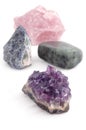 Four big different gemstones crystals on white background