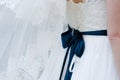 Big, dark blue bow, on bride corsage Royalty Free Stock Photo