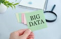 Big Data text with hands and colorful sticker