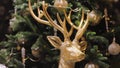 Big deer in gold figurine christmas tree decor. Interior noel design