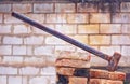 Big demotition hammer with brick background