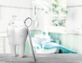 Big tooth and dentist mirror, medical concept Royalty Free Stock Photo