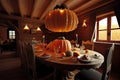 big dining table in chalet with pretty pumpkin decorations for holiday