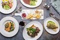 Big dinner table overhead view with steak and fish Royalty Free Stock Photo