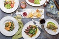 Big dinner table overhead view with steak and fish Royalty Free Stock Photo