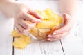 Big dish fulll of potato vhips and female take one Royalty Free Stock Photo