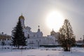 The big disk of the low winter sun and the Church of the Holy Trinity in Ivanovo Royalty Free Stock Photo