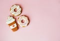 Big donut and Gingerbread donut on pink background birthday decoration