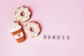 Big donut and Gingerbread donut on pink background birthday decoration