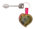 Big door key on green heart shaped key ring Royalty Free Stock Photo