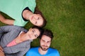 Big dreamers. High angle shot of a three friends lying down on grass. Royalty Free Stock Photo