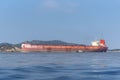 Big dry cargo ship sailing near Chinese sea coast. Royalty Free Stock Photo