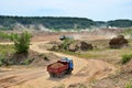 Big dump trucks working in the open-pit. Royalty Free Stock Photo