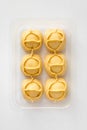 Big dumplings Manti in plastic container for sale. Royalty Free Stock Photo