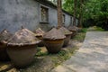 Big earthern jars for preserved food on ground Royalty Free Stock Photo