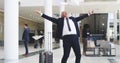 Big effort, big results. 4k video footage of a mature businessman throwing his paperwork in the air after receiving good