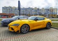 Big elegant modern yellow sport car Toyota Supra coupe left side and front view