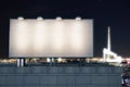 Big empty billboard on the background of the city at night Royalty Free Stock Photo