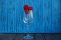 Empty glass glass with red heart on a blue background Royalty Free Stock Photo