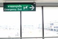 Big empty hall in airport with sign of emergency escape. Royalty Free Stock Photo