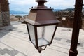 Big street light post lantern on city background Royalty Free Stock Photo