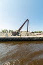 Excavator in the port