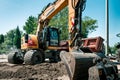 Big excavator, work on the road