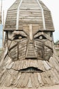 The big face of the wooden sculpture of the hero