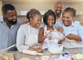 Big family, baking and learning while teaching girl to bake in kitchen counter, love and fun together in home. Black dad