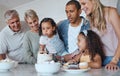 Big family, birthday cake and blowing candles for a wish at home with parents, grandparents and children together for a Royalty Free Stock Photo