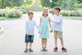 Big family. Brothers and sisters. Children are walking in the park. A group of three children in a summer forest. children play