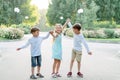 Big family. Brothers and sisters. Children are walking in the park. A group of three children in a summer forest. children play