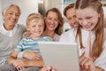 Big family, children and tablet for elearning, online education and learning website on home sofa with parents and Royalty Free Stock Photo